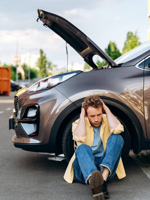 young-guy-near-the-car-with-an-open-hood-1-1.jpg